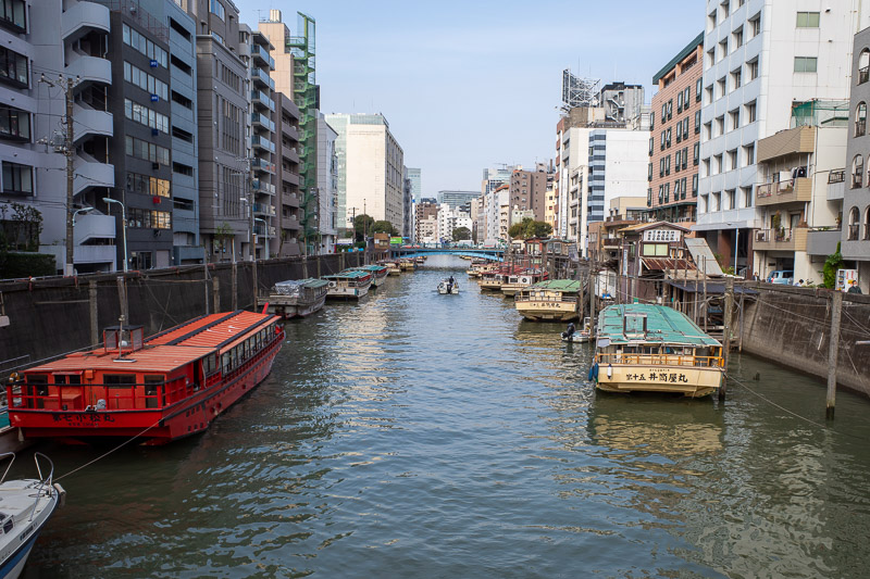 Japan-Tokyo-Sumida River - Here is a canal with some fishing boats parked, although I dont know where they fish as there are signs all along the river advising that the water is