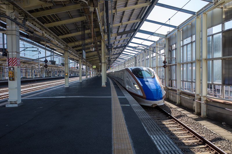 Japan-Takasaki-Niigata-Shinkansen - Here comes a train. Not my train. This line has the double decker trains, I dont think I ever rode on one in Japan. This however is a normal, single l