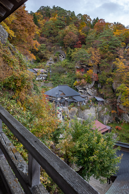 Japan-Hiking-Omoshiroyama-Yamadera - Looking back towards the cliff face with all the little buildings clinging to it.