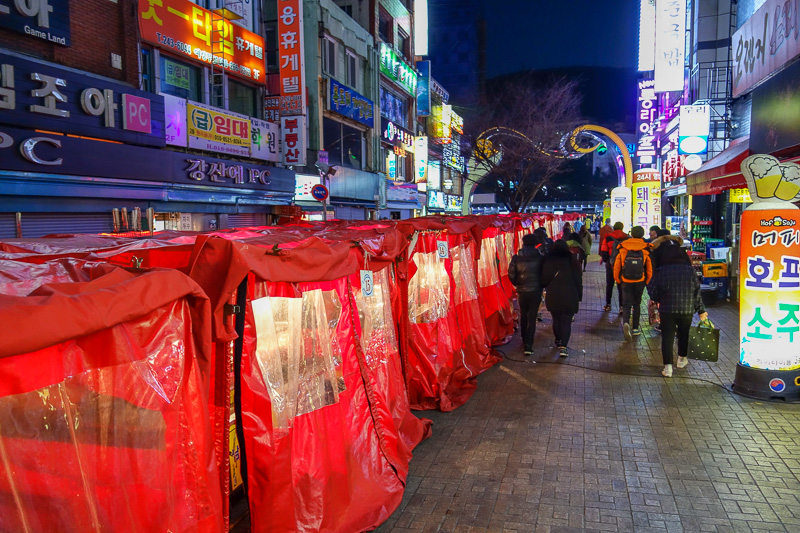 Korea again - Incheon - Daegu - Busan - Gwangju - Seoul - 2015 - In each of these red tents is a different pop up restaurant, selling things on sticks mainly.