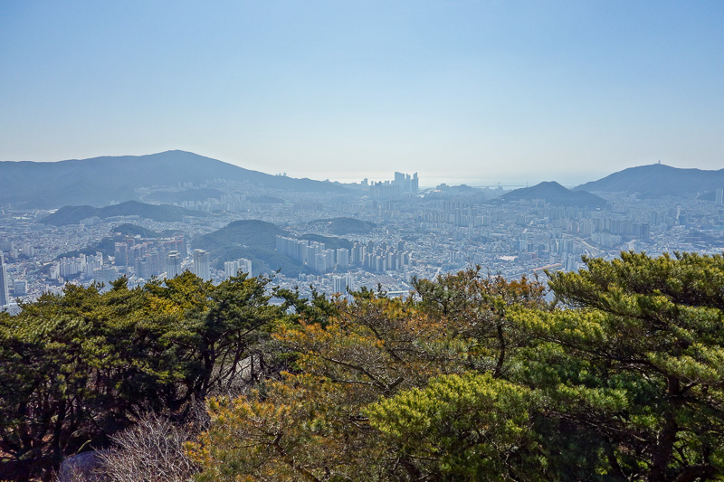 Korea again - Incheon - Daegu - Busan - Gwangju - Seoul - 2015 - Taken from near wear the cable car tops out. Those big buildings by the ocean are the futuristic part of Busan. Note all the hills in the city itself,