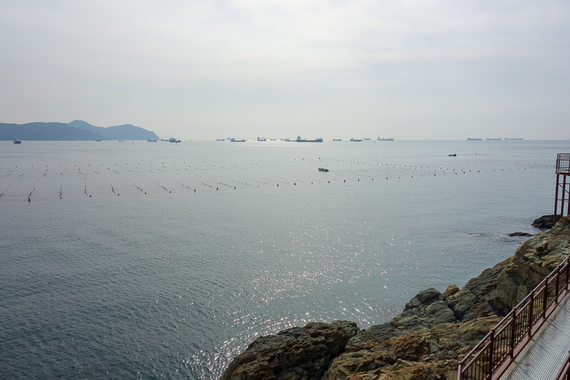 Korea again - Incheon - Daegu - Busan - Gwangju - Seoul - 2015 - Ocean boardwalk affords a great view of the local oyster farms. Their delicate flavour is accentuated by the shipping frequenting the worlds second bu