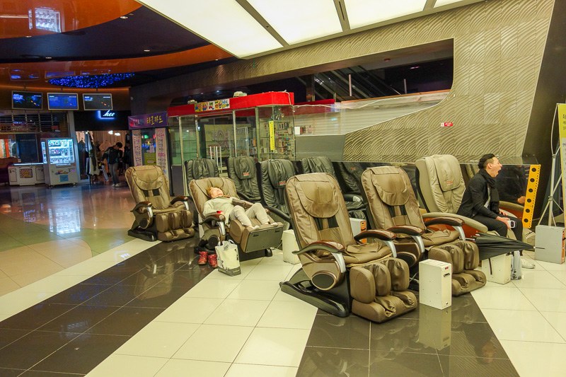Korea-Gwangju-Pizza-Rain - Massage chairs are plentiful. Heres 9 of them. People here use them though, actually pay the money and enjoy the massage, rather than just occupy them