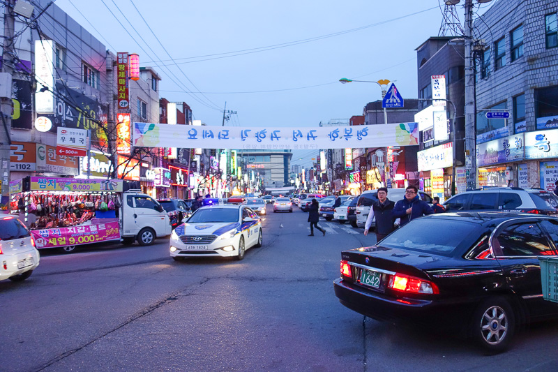 Korea again - Incheon - Daegu - Busan - Gwangju - Seoul - 2015 - This is an entire street of BBQ places. I wanted to go, but I dont think it works with one person. The better ones have no exhaust vents, just rooms f