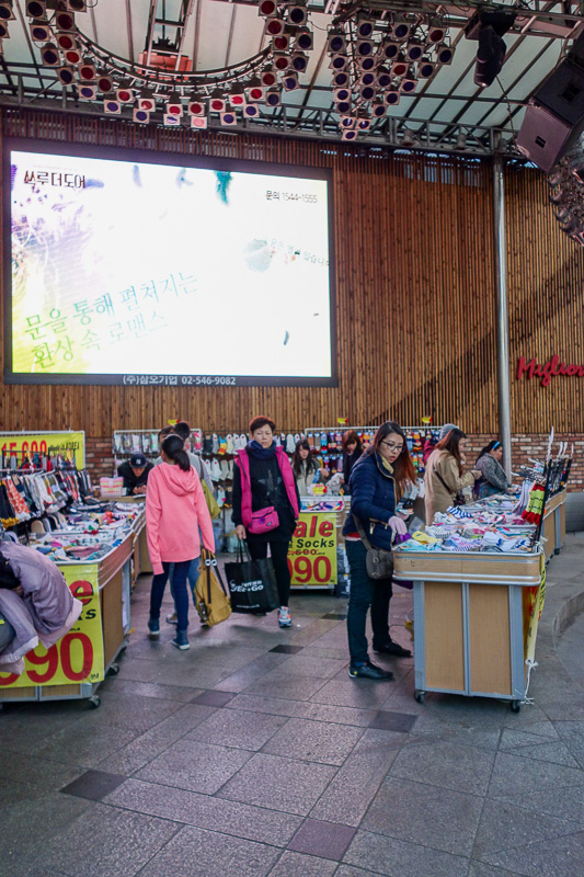 Korea again - Incheon - Daegu - Busan - Gwangju - Seoul - 2015 - This is a stage outside a department store, note the screen and lights. Except its been infiltrated by....you guessed it, a sock selling lady.