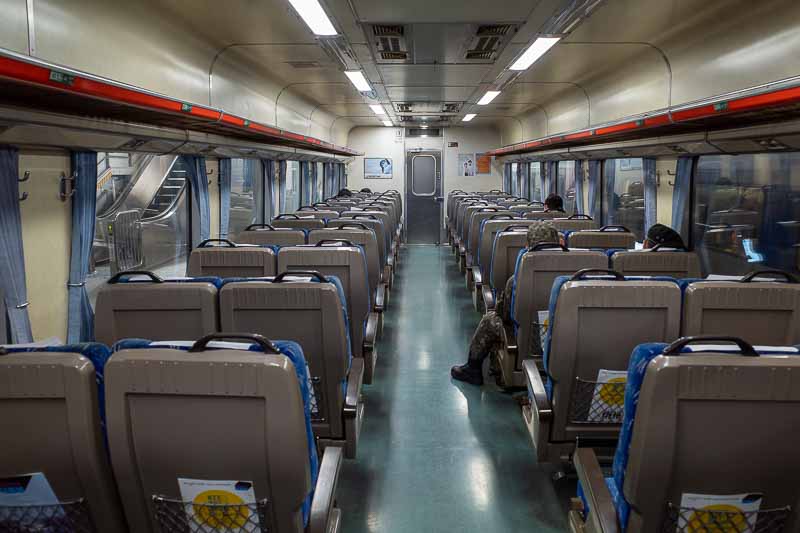 Korea-Seoul-Suwon-Train - Inside it is dated, but very solid and comfortable, big seats. Hardly anyone onboard. This particular train goes to Daejeon, a city I went to last tim