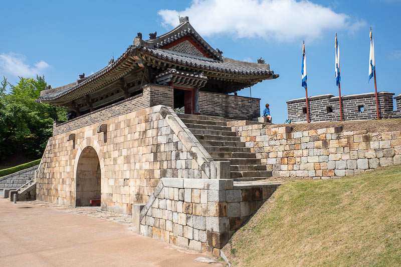 Korea-Suwon-hwaseong fortress - Lots of people pose for photos, I tried to stay out of their way, you can see one lady here striking a pose for a camera person out of view.