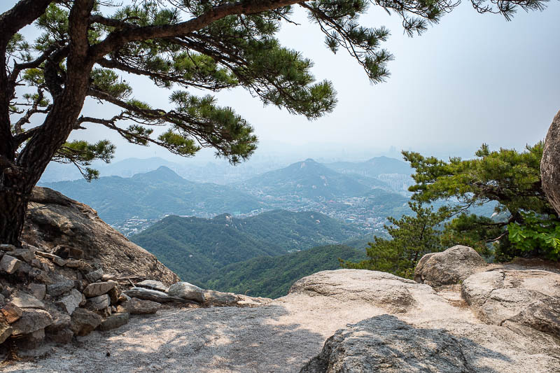 Korea-Seoul-Hiking-Bukhansan - A view of pollution and some other mountains dotting around the Seoul skyline. I have climbed most of them.