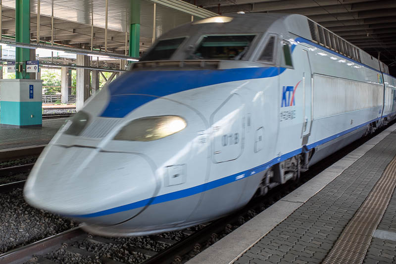 Korea-Suwon-Daegu-Train - Here comes my bullet train. Complete with speed blur. I also learnt today they are French designed, based on the TGV. I bet if I look at one of my pre