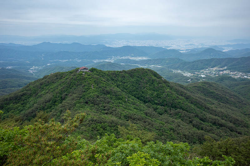 Korea-Daegu-Hiking-Palgongsan-Gatbawi - That little house is the cable car station. Its a shame it was cloudy from a view perspective, but great from a temperature perspective. Am I using th