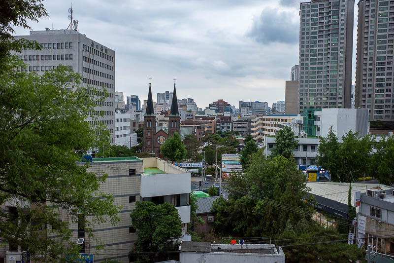 Korea for the 4th time - May and June 2022 - View from the church has.. another church. Does the small old church feel inferior looking at the enormous new church? Do the parishioners fight each 