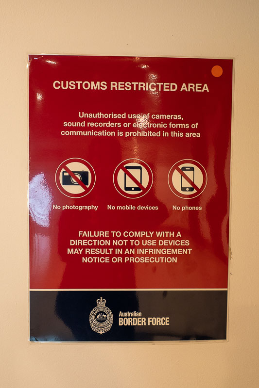 Melbourne-Airport-Singapore Airlines - Apparently its now illegal to use a phone or anything electronic at the departure gates. This sign was not in the customs area with the eyeball scanni