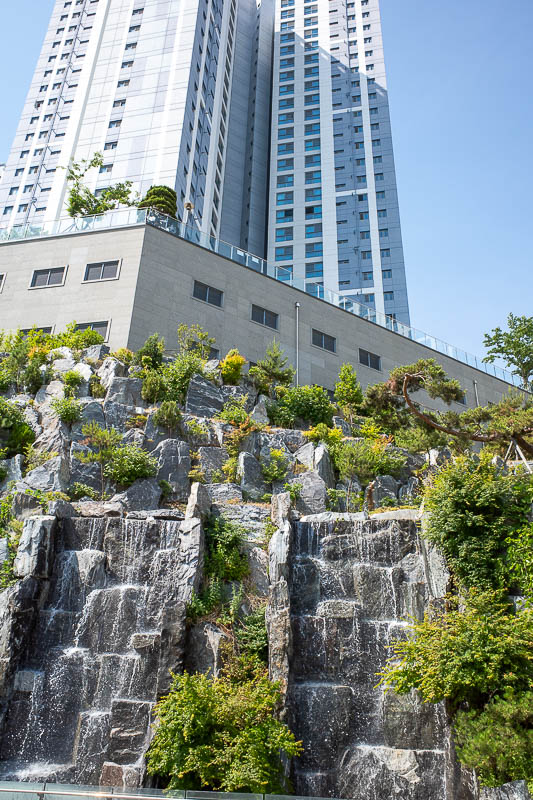 Korea-Busan-Beach-Haeundae - Apartment building comes with its own waterfall. I wonder what the strata fees are for that?