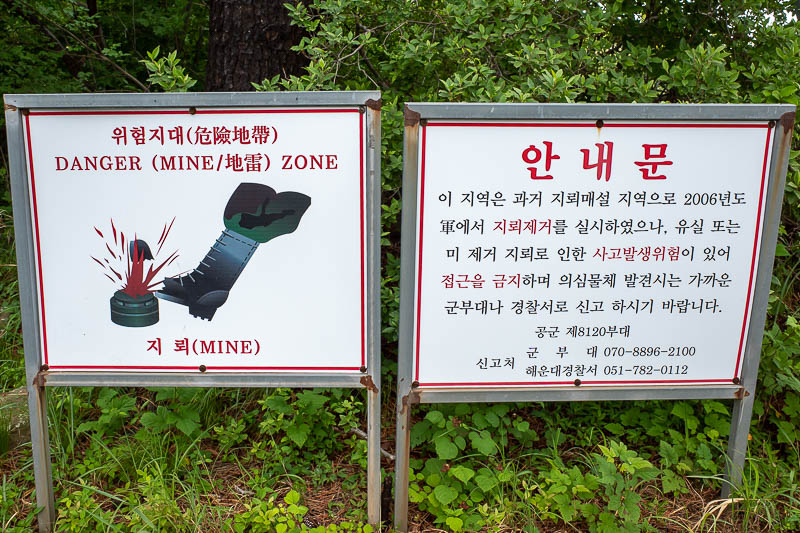 Korea-Busan-Hiking-Jangsan - These signs are quite common on Korean mountains. I do not know if they are really for that. There is an army base on the top and lots of razor wire, 