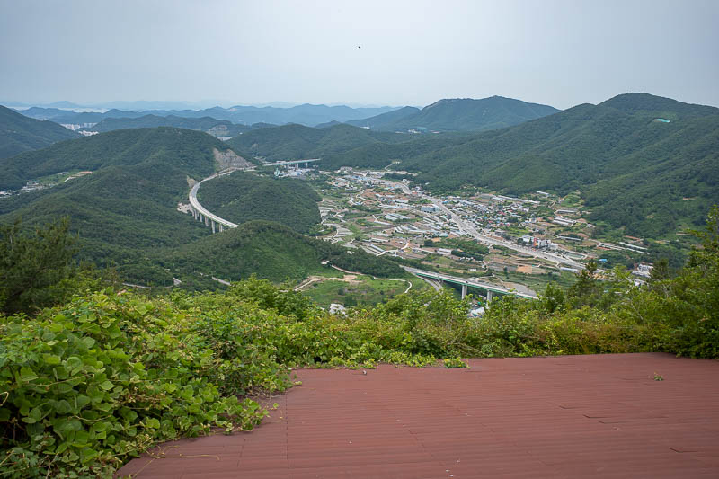 Korea-Yeosu-Hiking-Gubongsan - Here is a view down a different valley of some farms you can paraglide over, then land on that highway.