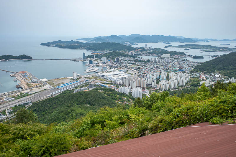 Korea-Yeosu-Hiking-Gubongsan - And here is a view back to the main part of Yeosu. You can see the train station on the left, where I would descend to, and the world expo site just t