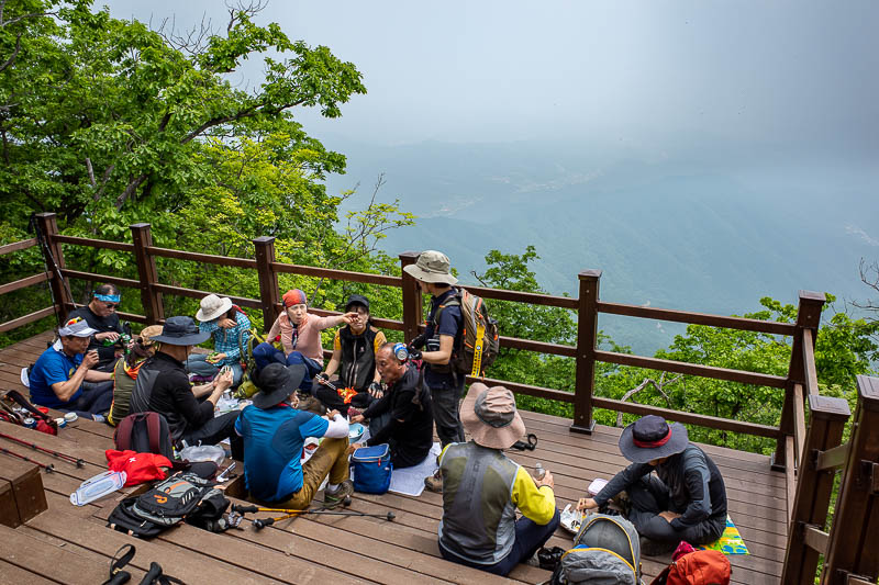Korea-Seoul-Hiking-Yongmunsan - Here is a group of people enjoying lunch, I suspect they came up from a different shorter trail, on close inspection there is a road that comes a fair