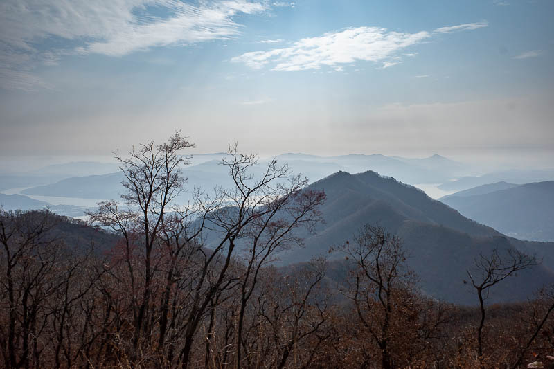 Korea-Seoul-Hiking-Yebongsan - Here is a bit more smoke with peaks peaking through it. After peak 1, I just skipped along the most obvious trail and after about 20 minutes thought t