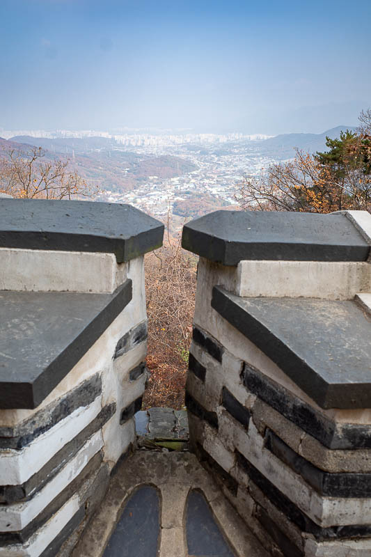 Korea-Seoul-Namhansanseong - A wall with a very smoky city below. Very smoky. Depending on the direction of the sun, terribly smoky. Remember when 2 days ago I was celebrating the