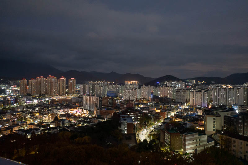 Korea twice in one year - November 2022 - Handheld view number two, many more modern apartment buildings and mountains. I think my area of town has a lot of older buildings, and a university.