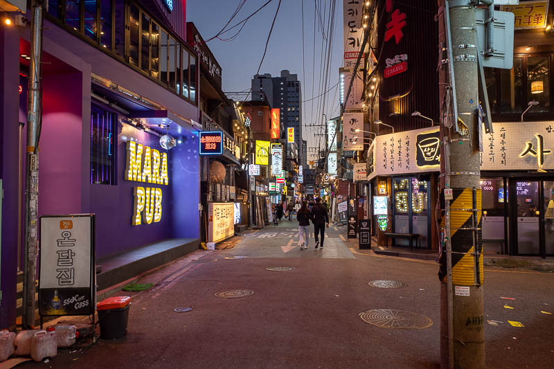Korea twice in one year - November 2022 - I initially walked past all the neon, to go to the very last Tarot card reader, and am now making my way back.