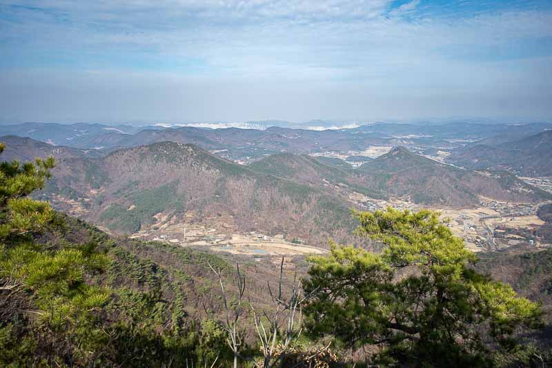 Korea-Daejeon-Hiking-Gyeryongsan - The view down the other side. That city in the distance is not Daejeon, it is the new government capital city area called Sejong, where they plan to m