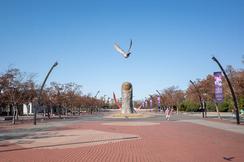 Korea-Seoul-Olympics - I have no idea why there is a giant thumb. Also, a flying bird.