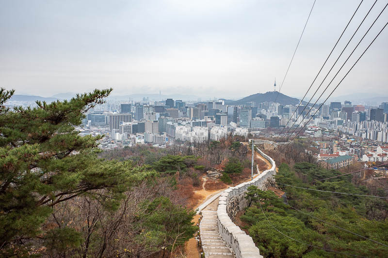 Korea-Seoul-Hiking-Inwangsan - More of the view, this time with the wall, and some wires. Lots of wires up here due to the military posts, which did not have soldiers standing guard