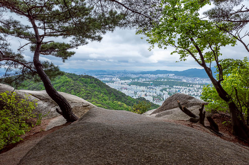 Korea-Seoul-Hiking-Buramsan - A view with trees and rocks.