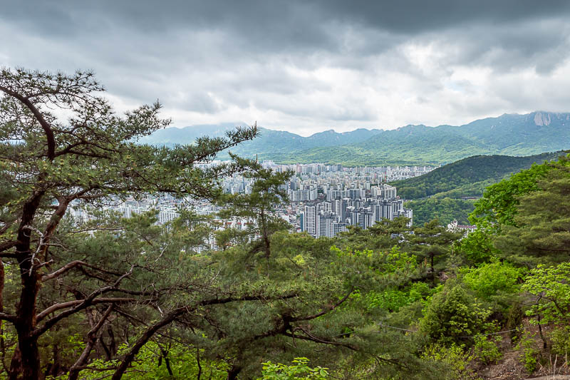 Korea-Seoul-Hiking-Buramsan - Nice light with the dark clouds and almost sunshine on the distant mountains. I have climbed all those mountains previously, including in the first we