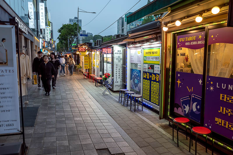 Korea-Seoul-Konkuk - There are 50 or more stalls along here featuring fortune tellers, palm readers, tea leaf readers, tarot card readers. Weird.