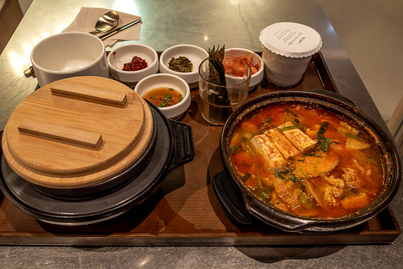 Korea-Seoul-Yeouido-Food - However this time I ate in basement 3 of the nearby IFC mall. My dinner is spicy tofu stew, with mystery meat, and all the side dishes. There is rice 