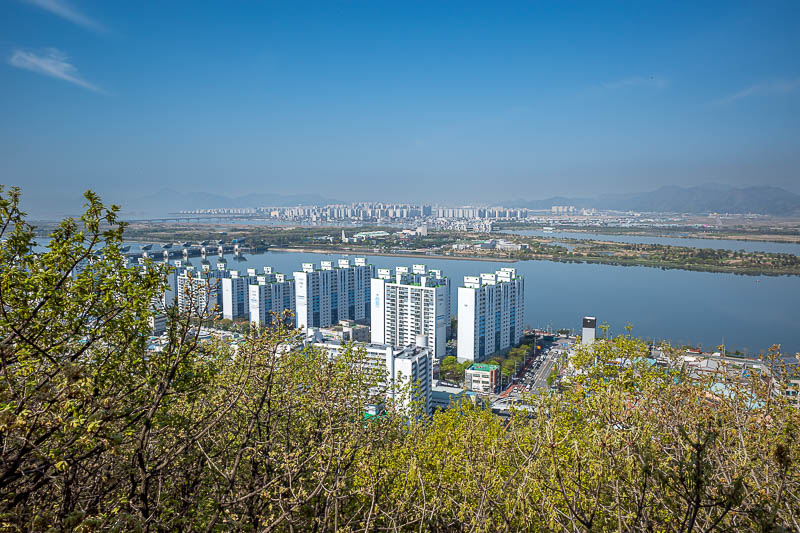 Korea-Busan-Hiking-Seunghaksan - This low down view is looking away from Busan, but still more high rises, and a nearby eco island bird sanctuary.