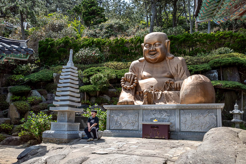 Korea-Busan-Haedong-Temple - Today's Buddha is a plastic gold coloured fat Buddha.