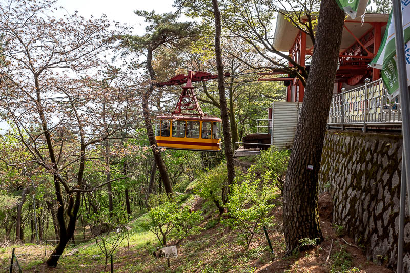 Korea-Busan-Hiking-Geumjeong - There is the cable car. It is operating. It is old and appears to have a driver.