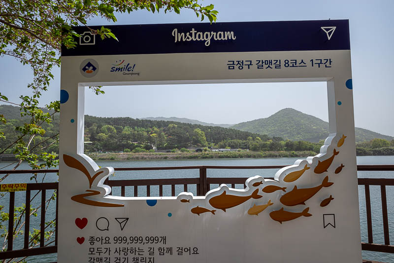 More of the same of Korea - March and April 2024 - At the far end of the lake there is a bus stop, cafes, and an instagram advertisement.