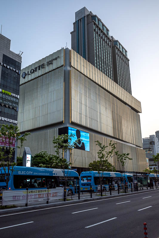 Korea-Busan-Seomyeon-Buldak - The Lotte store at Seomyeon is gold coloured and has grown a hotel out of it's roof.