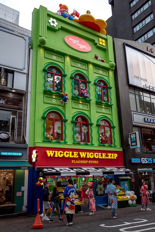 Korea-Seoul-Myeongdong - New ridiculous shops have sprung up everywhere, such as the (reads sign...) wiggle wiggle.zip flagship store. I have no idea what goes on inside.