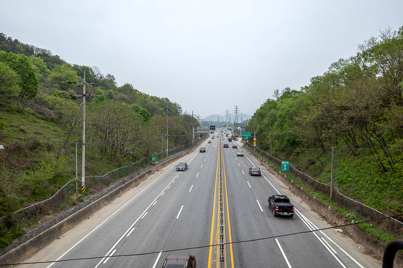 More of the same of Korea - March and April 2024 - I had to climb up a retaining wall and get back onto this bridge over a highway. I was already running behind schedule!