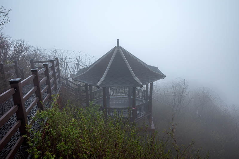 More of the same of Korea - March and April 2024 - There are a lot of barbed wire fences, but they still managed to stick a pagoda up here. It was very windy on the summit so I did not want to hang aro
