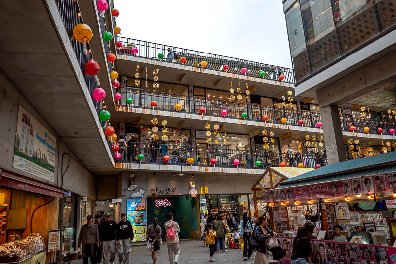 More of the same of Korea - March and April 2024 - This building with the spiral ramp is very popular for foreign tourists to buy gifts, it has been here forever. Now it has the coloured lanterns that 