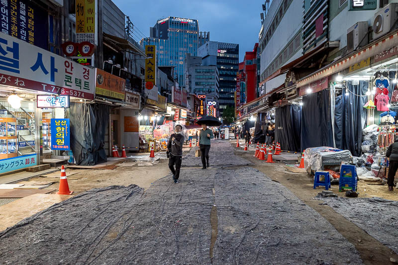 More of the same of Korea - March and April 2024 - I was going to walk back, but it started raining. This is Namdaemun market again, where the roads are lined with fabric.