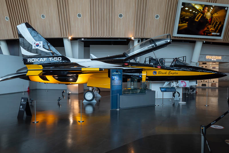Korea-Seoul-Museum-Fortress - A Korean designed jet. They made 200 of them. I climbed up the ladder to look into the cockpit and next thing a guy is there to help me climb in and s