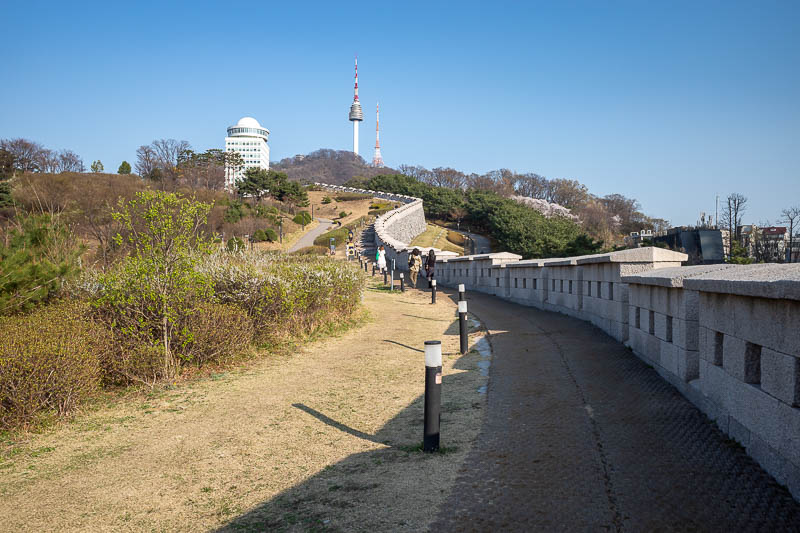 Korea-Seoul-Namsan-Itaewon - The wall actually descends down into the city behind where I am standing, but it is newly re-created.