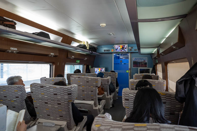 Korea-Changwon-Daejeon-KTX - Here is my fancy first class train seat. I am on my own, the other side of the aisle has 2 seats. Due to the sick guy nearby I spent about 8 minutes e