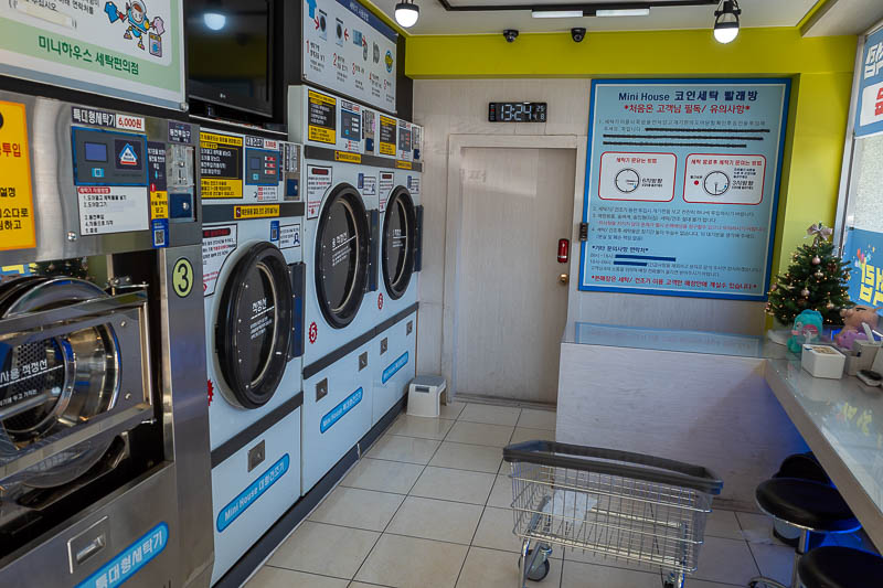 Korea-Changwon-Daejeon-KTX - The coin laundry was small, but modern. I sat at that desk at the end of this photo and attended a work meeting on my laptop.