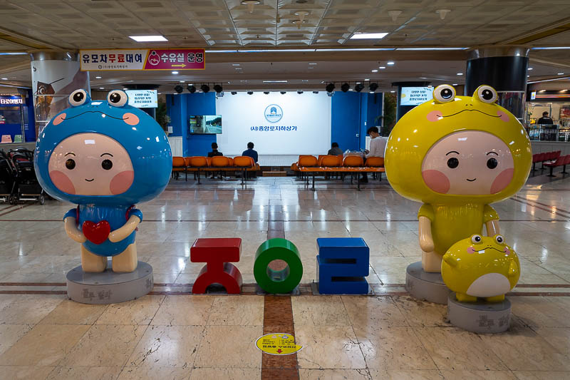 Korea yet again for the 7th time - March and April 2026 - The mascots are guarding the indoor below ground theatre. There is no show, but people are sitting and waiting anyway.