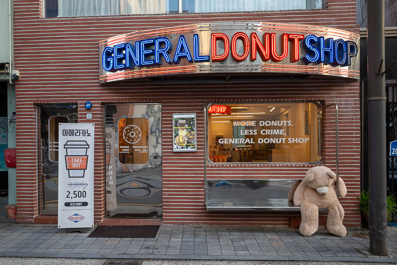 Korea-Jeonju-Kimchi - The sign says 'More donuts, less crime, general donut shop'. I guess they got their man (bear).