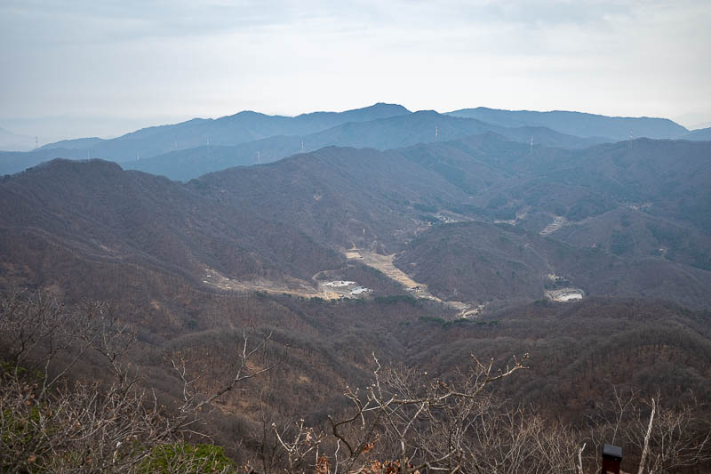 Korea-Seoul-Hiking-Soyosan - Down there over the far side is the army live firing range. I will be seeing some of those mountains in the distance up close in a few days time.