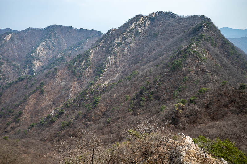 Korea-Seoul-Hiking-Soyosan - Some time later, and this is looking back along the ridges I had come along. Clearly a bit sunnier now. Most of the grey is pollution.